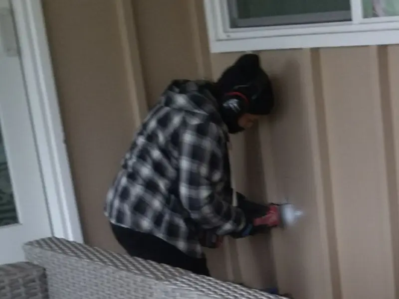 Professional electrician installing an exterior outlet in Lisbon